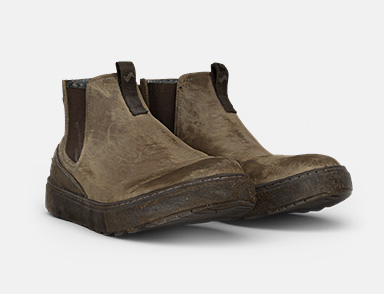 Click to shop women's Lucie Chelsea. Image feautres a worn pair of Lucie Chelsea's in loden. 