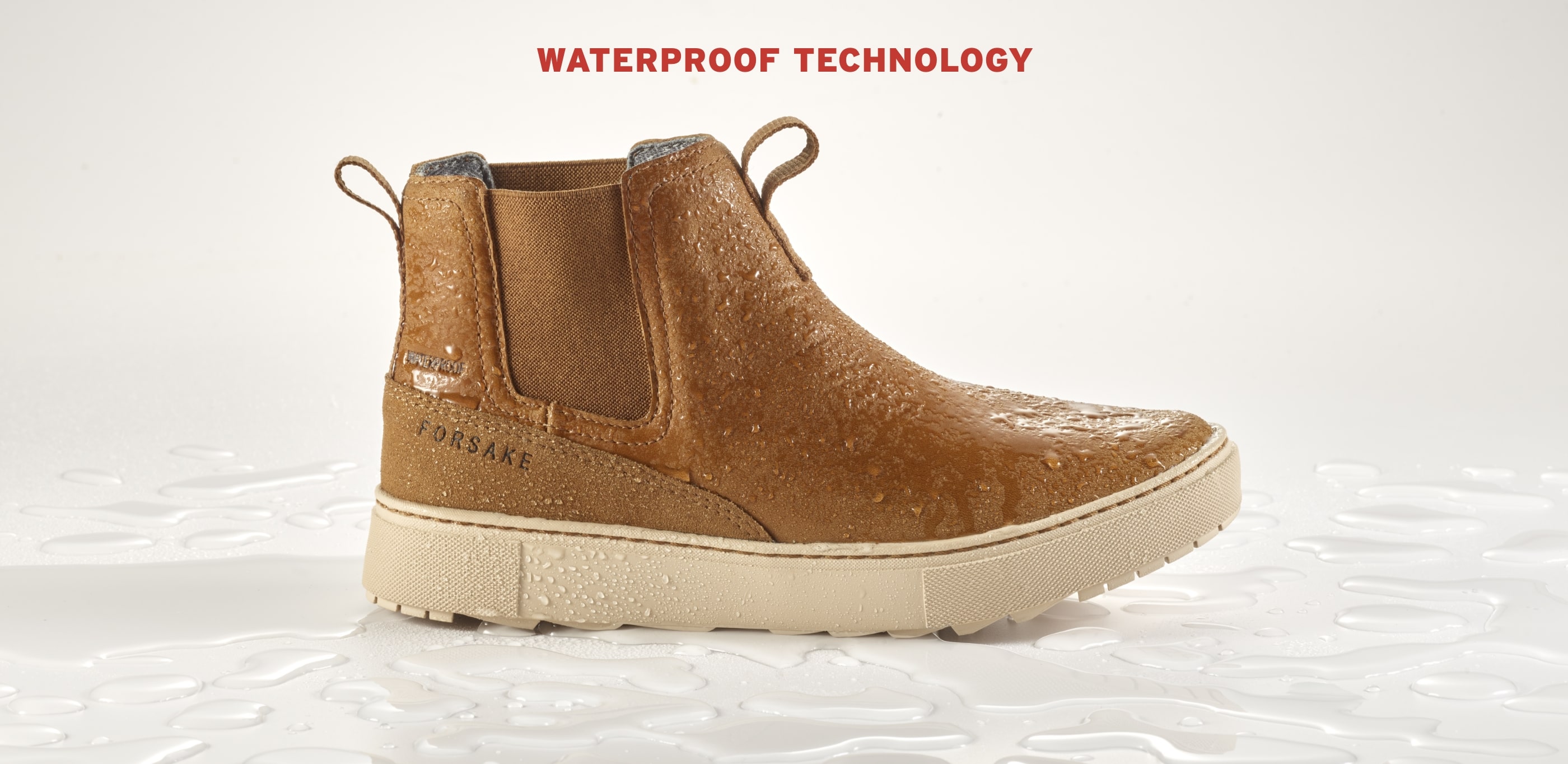 Click to shop men's or women's waterproof technology. Image features the Lucie Chelsea in tan. 