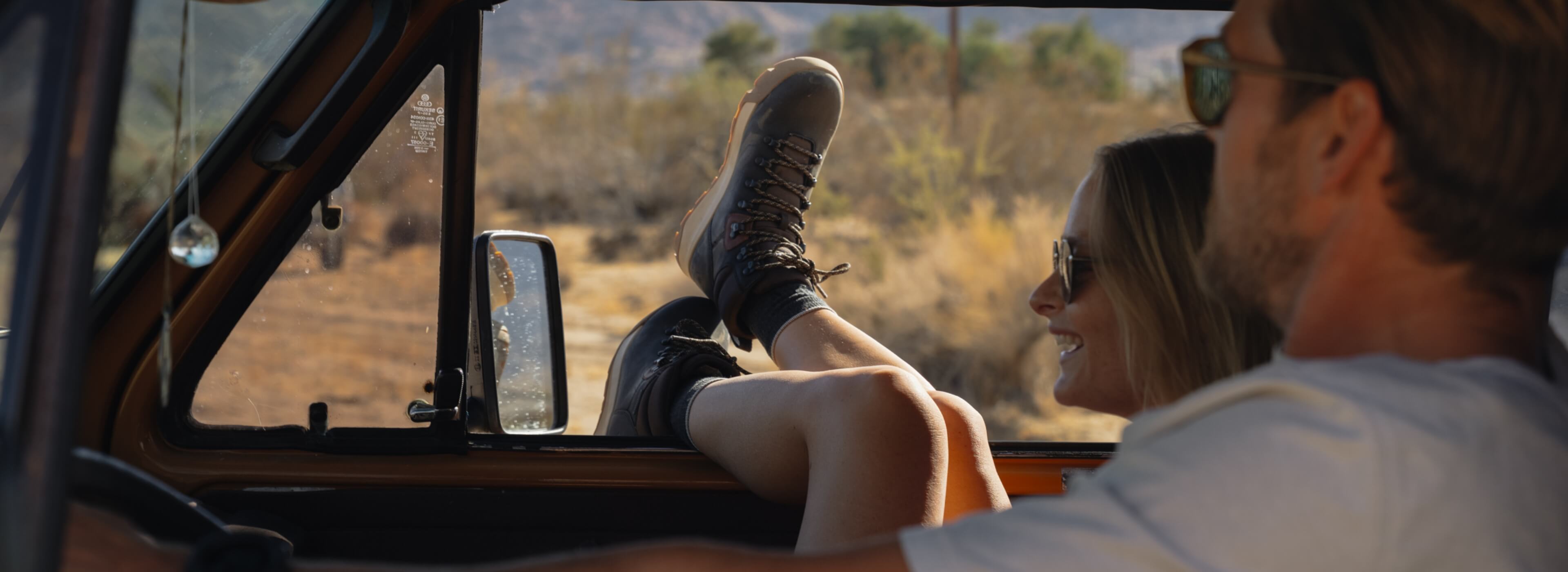 Shop Forsake's new arrivals featuring a man and woman in the front seat of a car. 