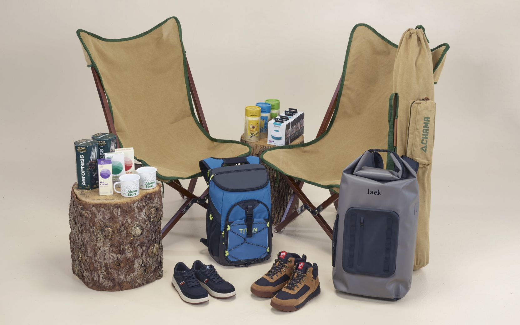 Enter our sweepstakes for our Ready For Anything Adventure Kit. The featured image displays each individual prize that is a part of our giveaway including: two pairs of Forsake shoes, Titan by ArcticZone 24-Can Backpack Cooler, waterproof backpack from Laek Gear, coffee sampler, cocktail sampler, and mugs from Alpine Start Foods, two Vaquero chairs from Chama Chairs, and two AeroPress Go Plus coffee makers.
