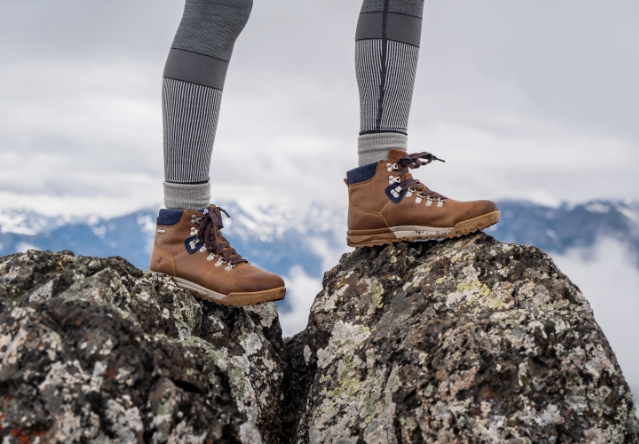 Shop our hiking styles. Image features the Patch Mid in brown and navy. 