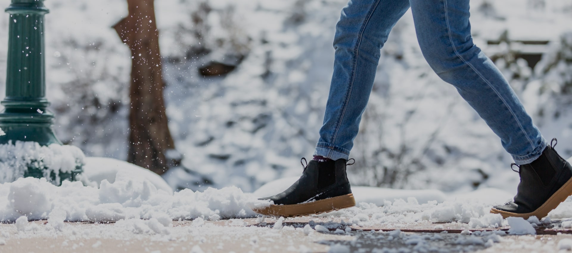 Click to shop Forsake men's and women's shoes. Image features the Lucie Chelsea in the snow. 