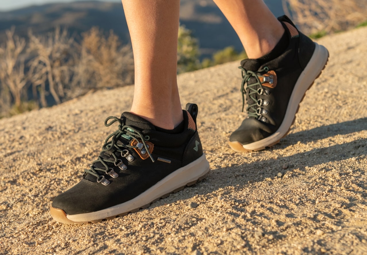Click to shop men's or women's hiking shoes. Image features the Thatcher Low WP in black.